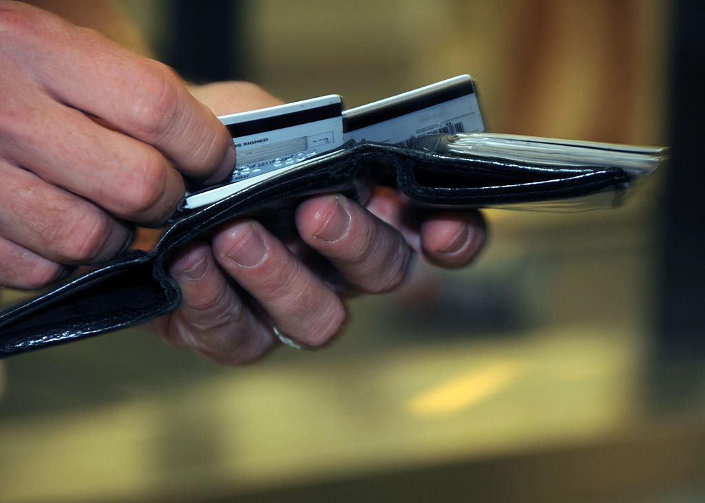 1024px-US_Navy_080918-N-0659H-001_A_Naval_Support_Activity_Mid-South_Sailor_takes_a_moment_to_decide_which_credit_card_to_use